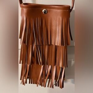 Small Fringe Cross Body. Fits a Large cell phone easily.